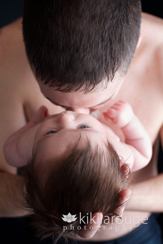 dad kissing baby