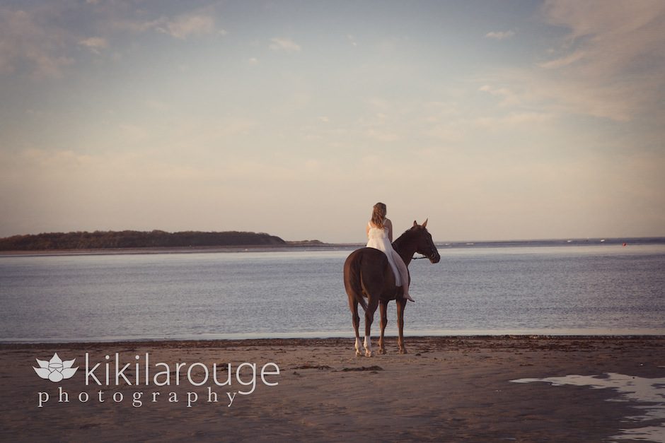 Girl on beach with horse
