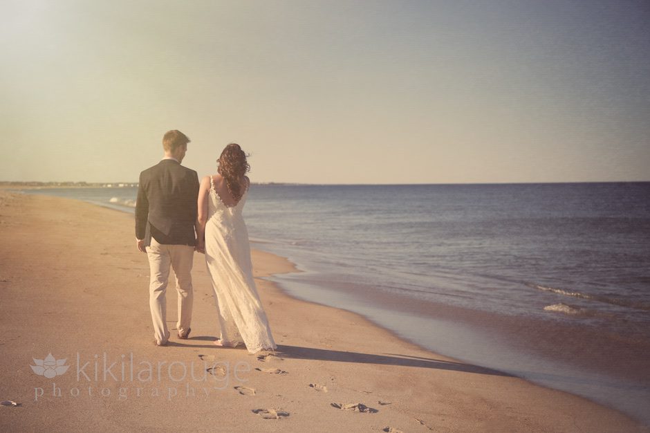 Bride and Groom walking the beach