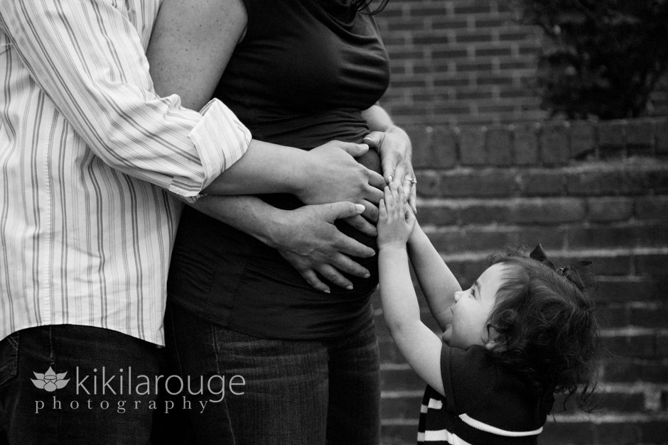 Maternity Portrait with toddler's hand on belly