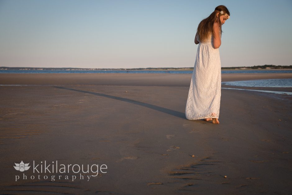 Girl in white dress on beach