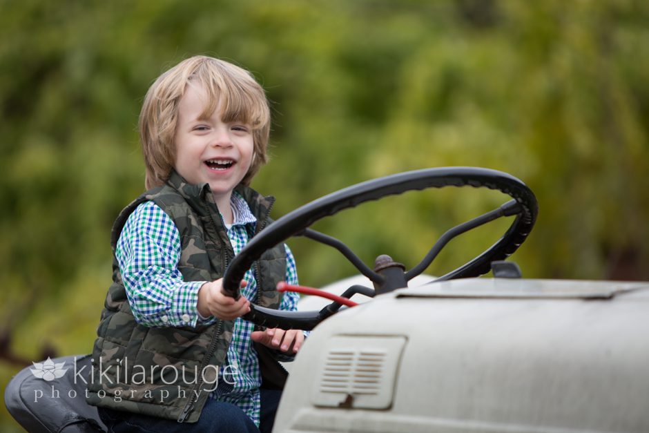 Boy laughing on a tractor