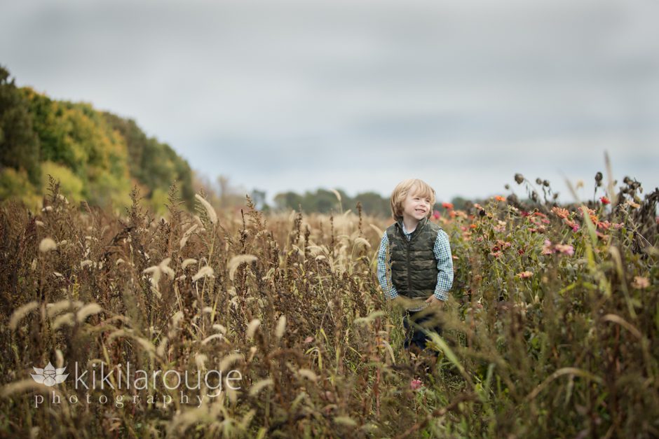 Portrait Little Boy in stunning field at farm