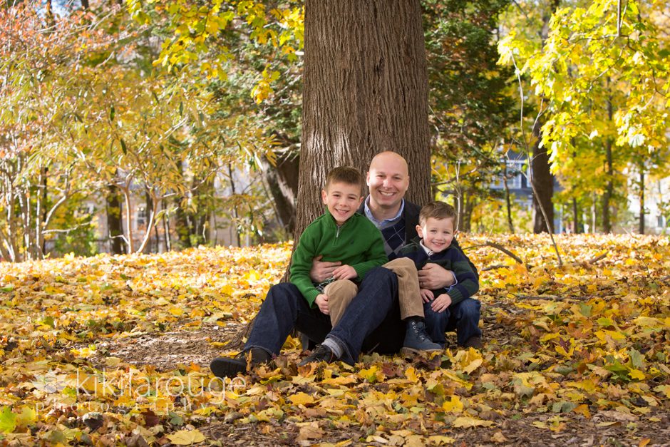 Little boys with Dad under fall tree