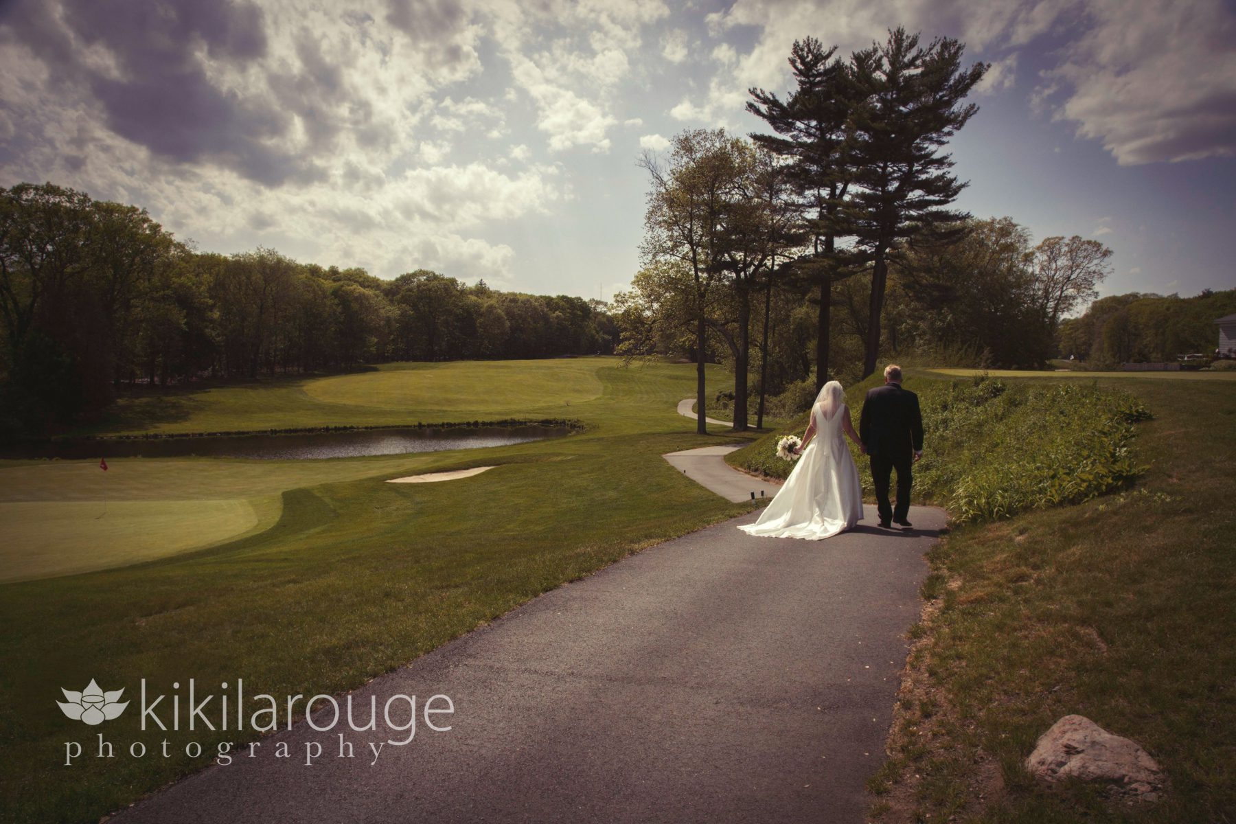 Landscape view of couple walking at wedding