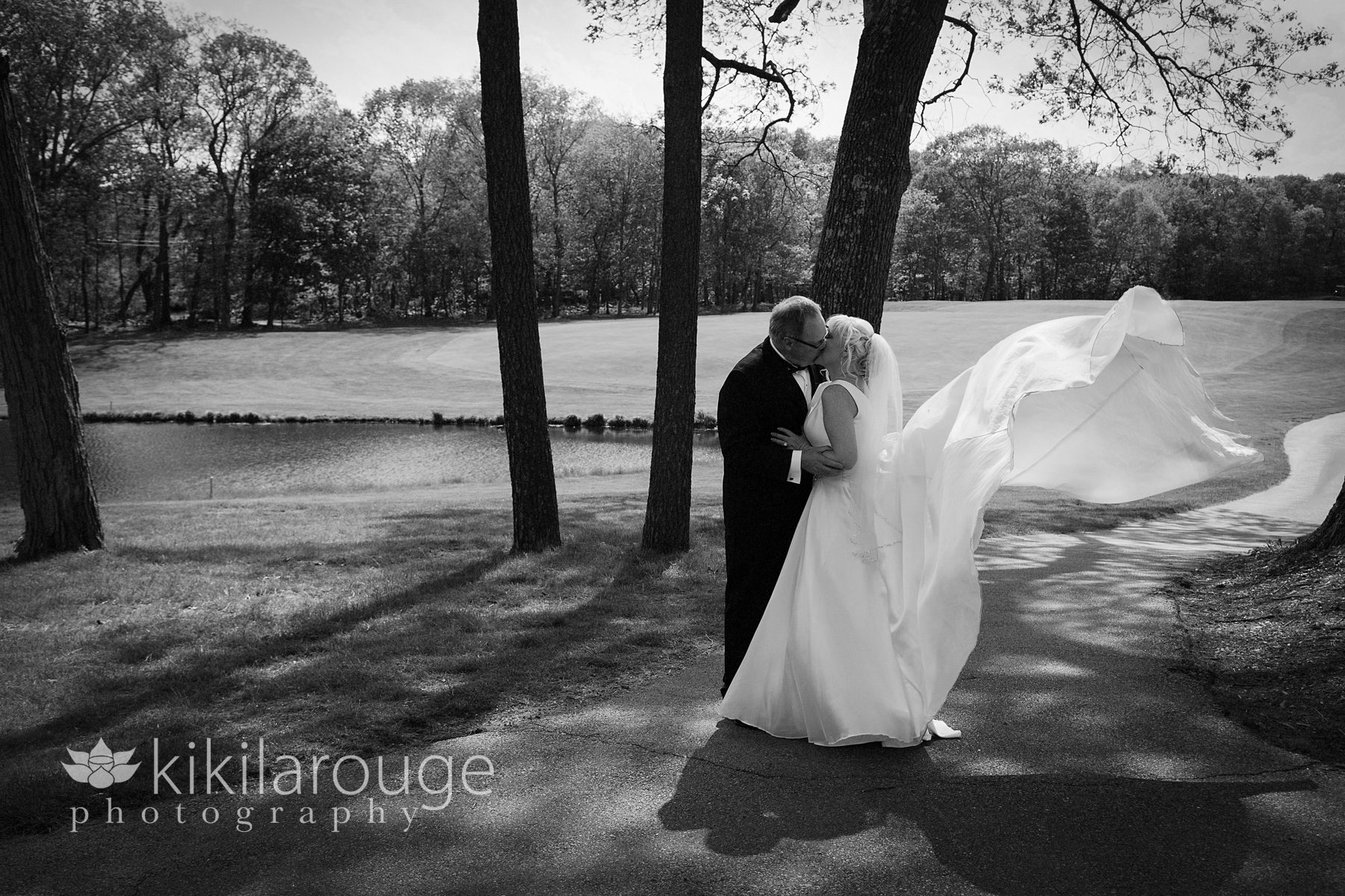 Couple portrait with wedding dress blowing