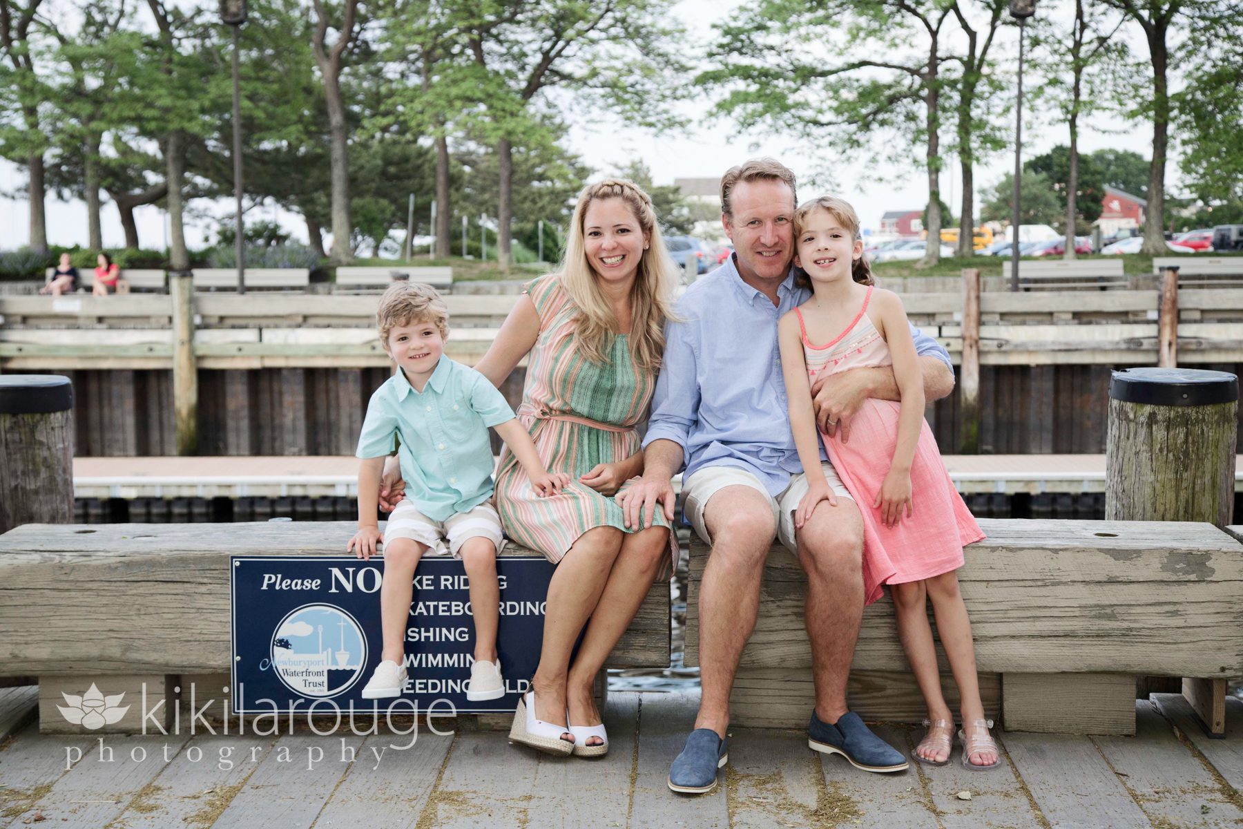 Family of four portrait on waterfront