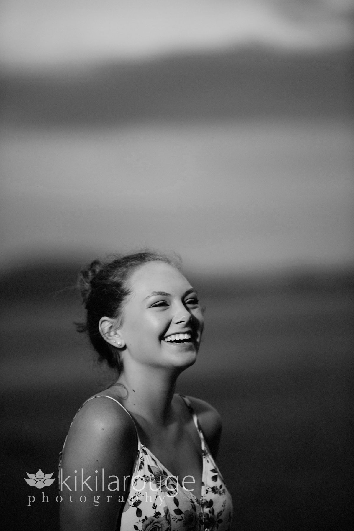 Black and white girl laughing at beach