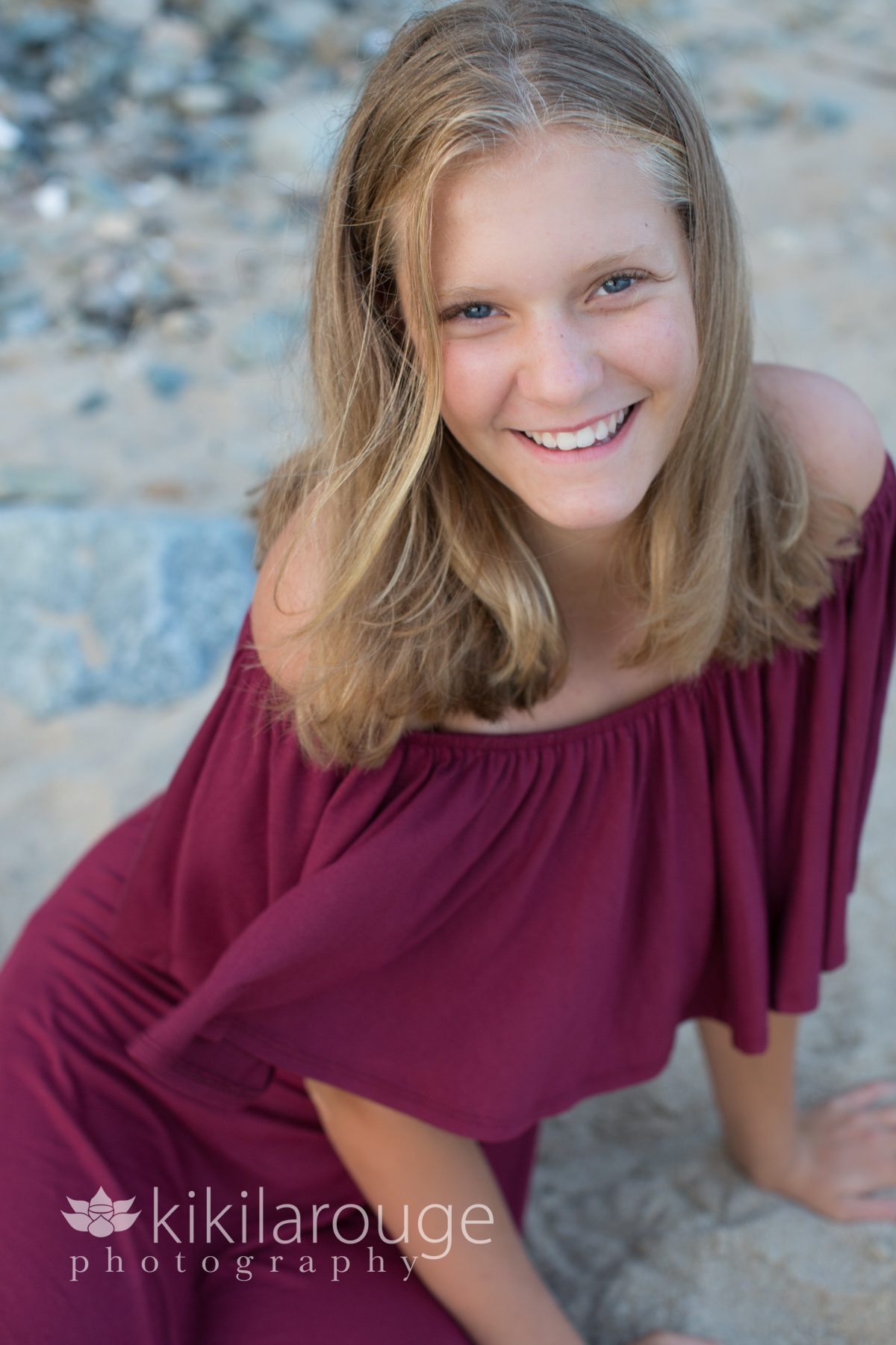 Girl on beach with maroon dress