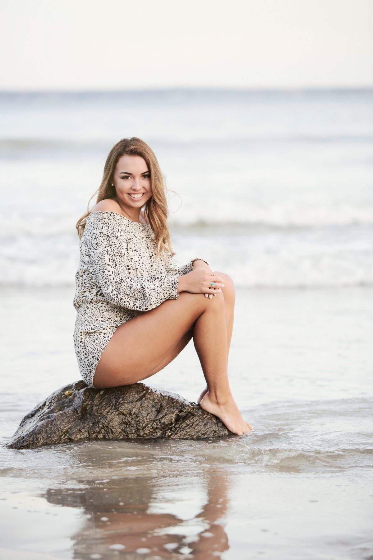 Senior Portrait sitting on rock in water