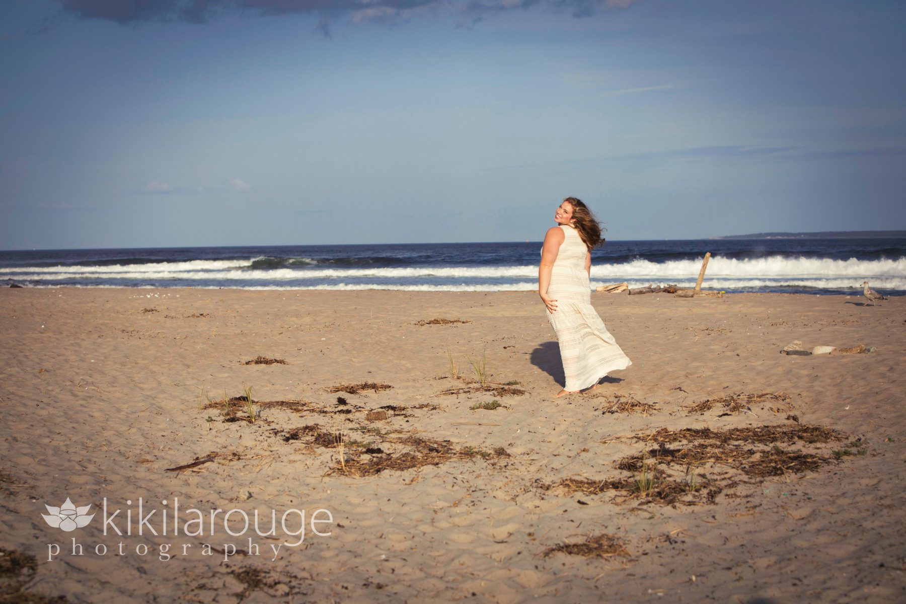Landscape Senior Portrait of girl in white dress at beach