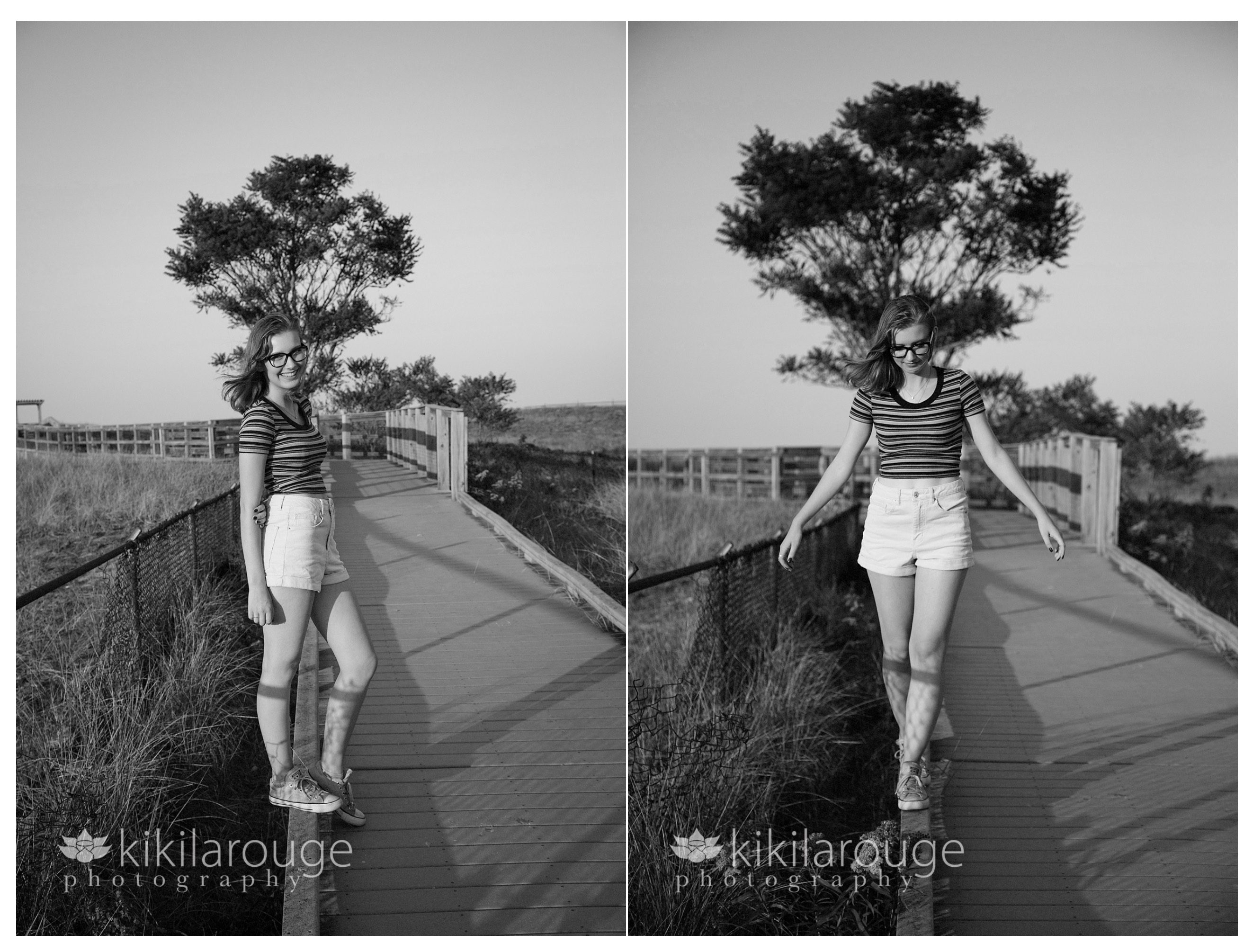 Girl balancing on beach dune walkway