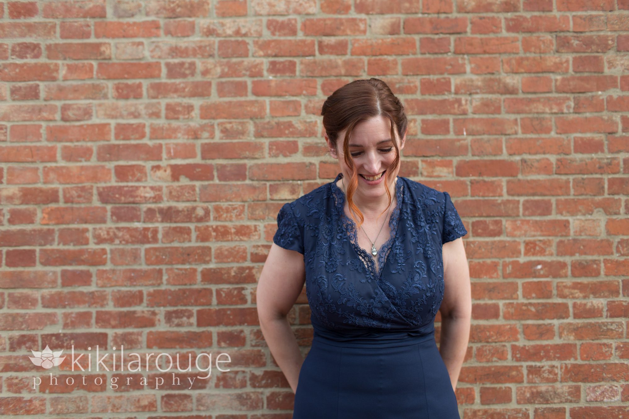 Bride in navy blue dress with red hair