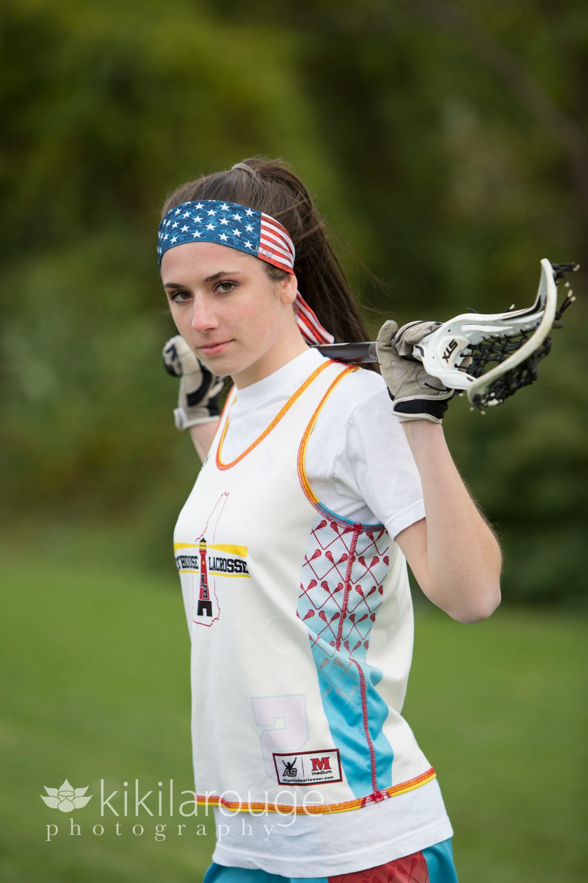 Girl with lacrosse stick