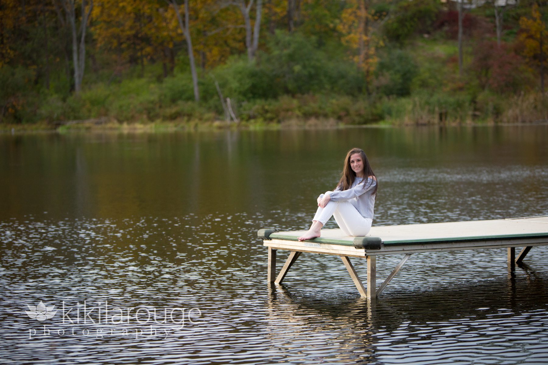 Girl white pants on dock at Mill Pond