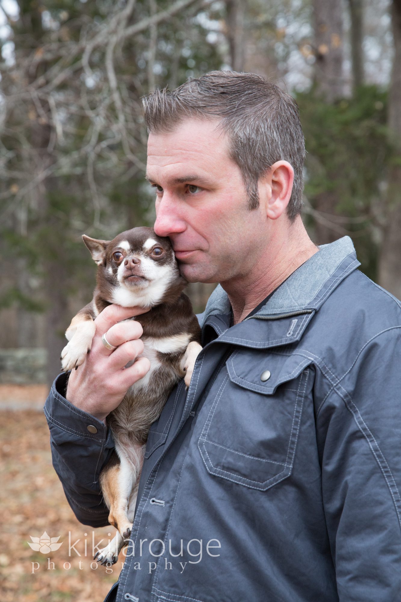 man with brown chihuahua