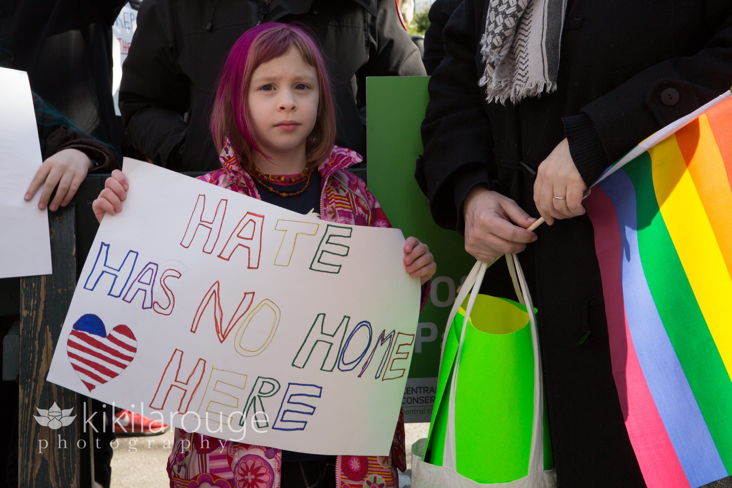 Hate has no room here sign by little girl
