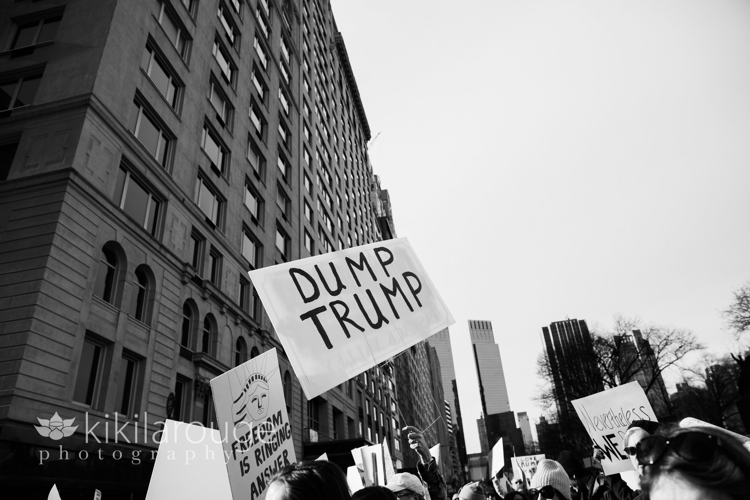 Dump Trump sign in front of Trump Parc