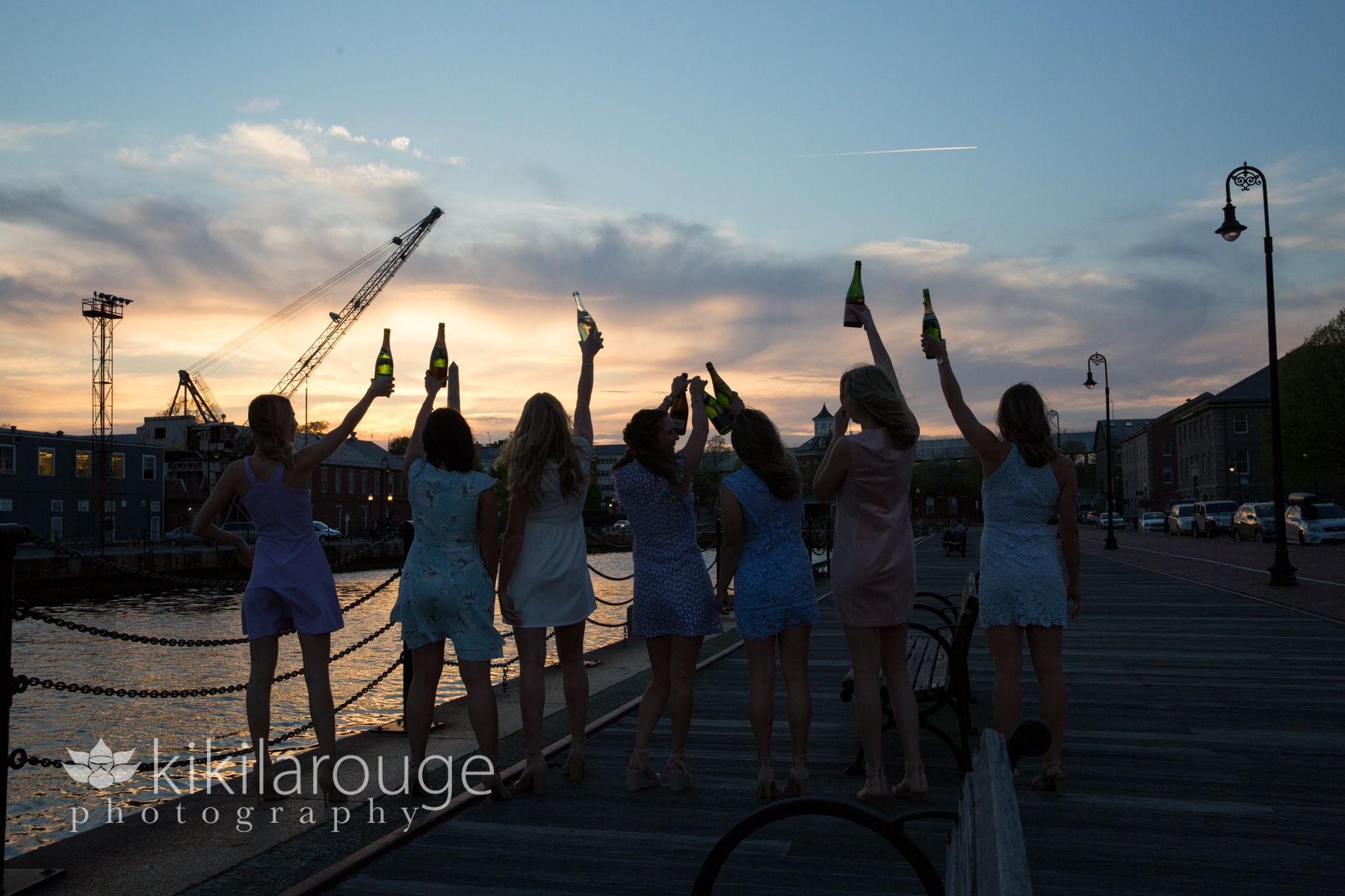 Girls toasting at sunset with champagne