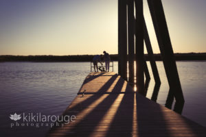 Couple with their two dachshund dogs at beach