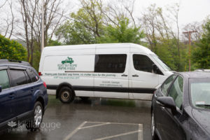 White rescue animal van in parking lot of shelter