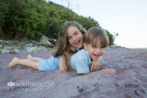 Sister and Brother laughing in purple sand at Plum Island