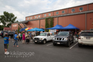 Parking lot view of dog rescue event at brewery