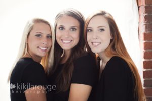 Portrait of three sisters all dresses in black