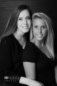 Portrait of two women one sitting below