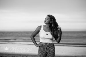 Senior girl white top seersucker pants on Plum Island Beach