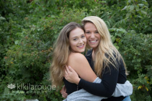 Sister laughing and hugging at Plum Island