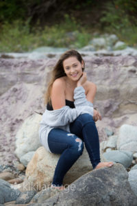 Girl with gray sweater off the shoulder Plum Island
