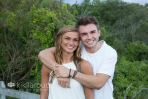 Both and sister hugging on Plum Island boardwalk