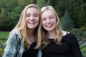 Portrait two blonde girls with big smiles