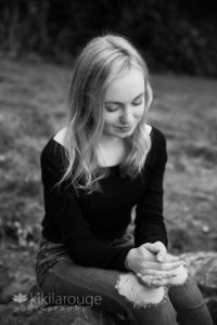 Young girl looking down with slight smile