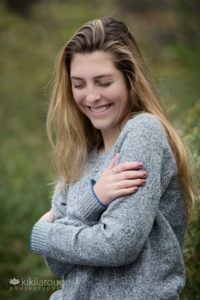 Girl laughing and looking down