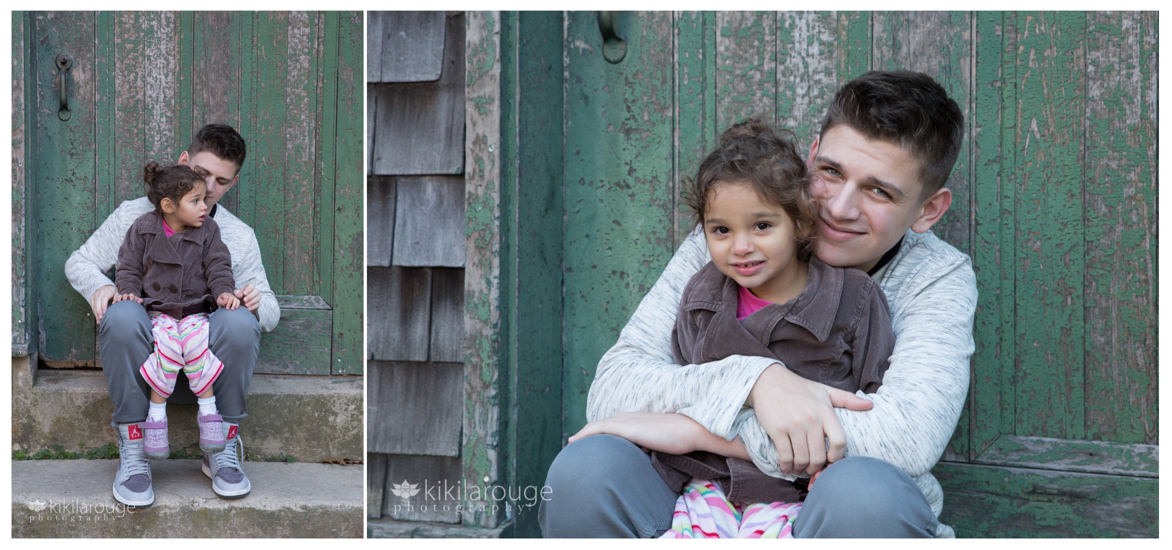 Senior boy with little sister at barn