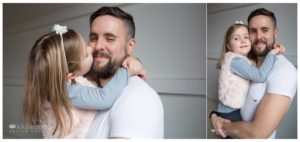 Little girl hugging and kissing her Dad
