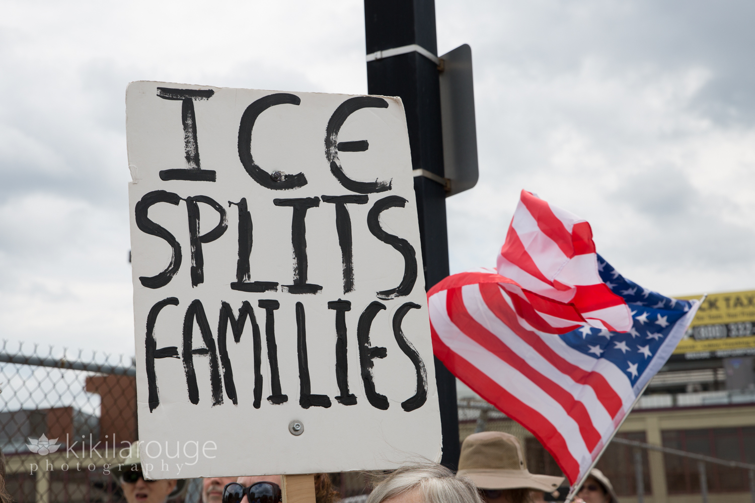 Protest Sign ICE Splits Families with American flag waving