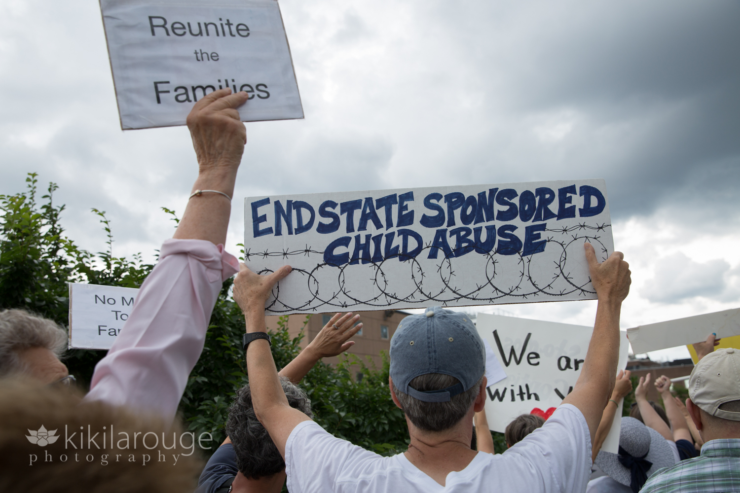 End Sponsored Child Abuse protesters sign at ICE Center