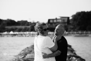 Couple celebrating new engagement on Ptown breakwater