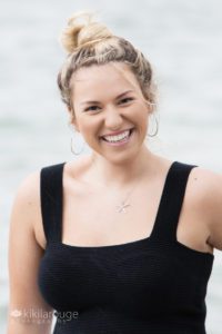 Girl with big smile and starfish necklace
