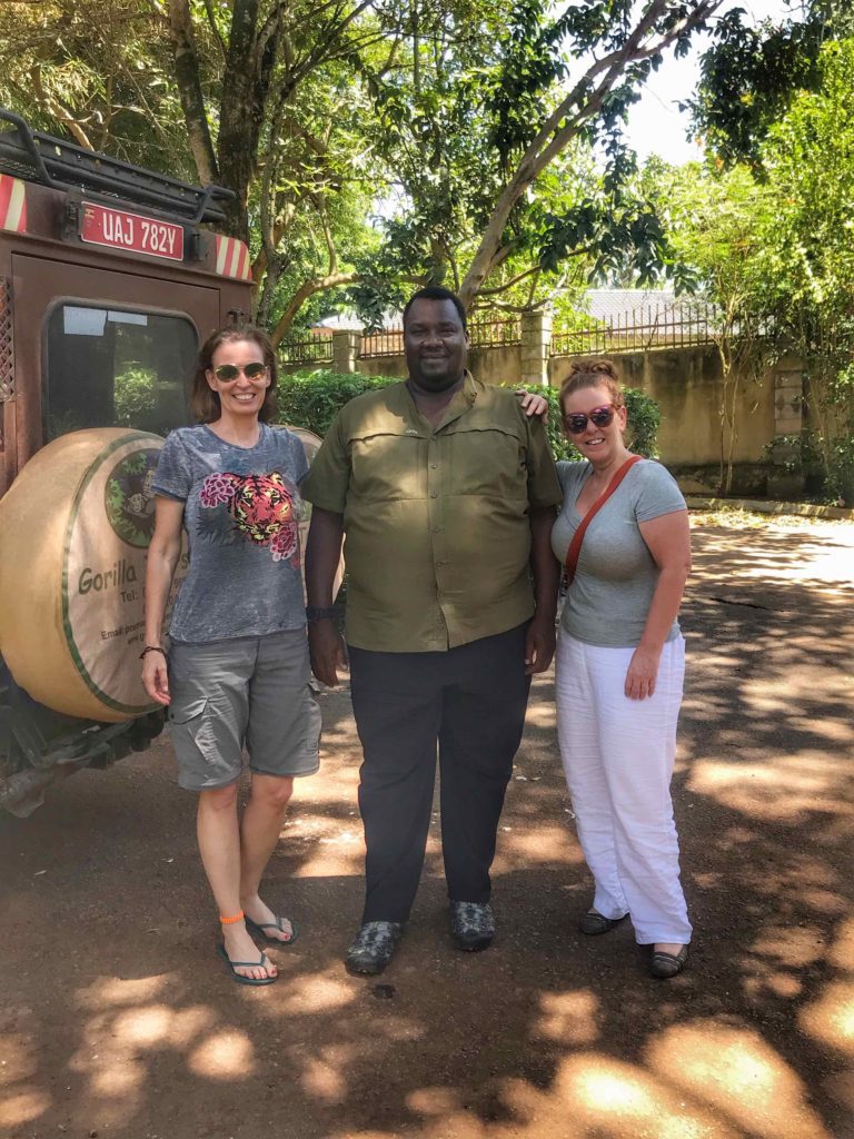 Ugandan tour guide with two American tourists 
