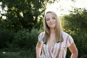 Senior portrait girl with sun flare