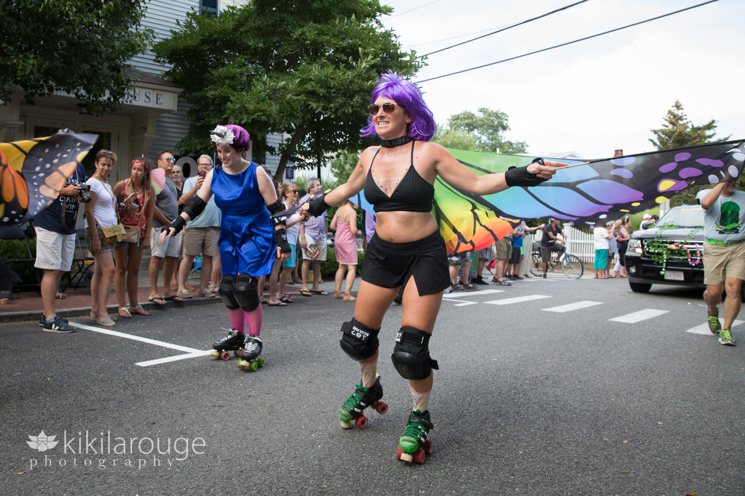 Roller derby woman with purple wig in parade