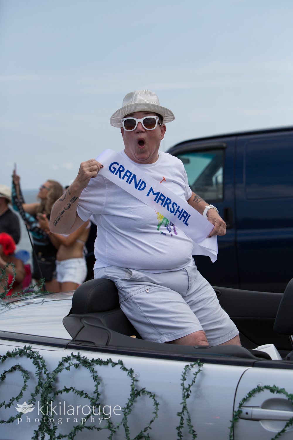 Lea Delaria showing her Grand Marshal sash in Ptown Parade
