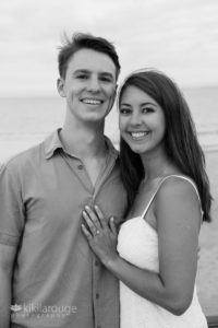 Newly engaged couple portrait with engagement ring