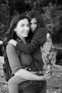 Mom and daughter walking and hugging