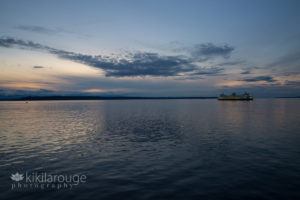 Ferry in Puget Sound at sunset and blue hour
