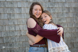 Two senior girls on photo shoot laughing and smiling